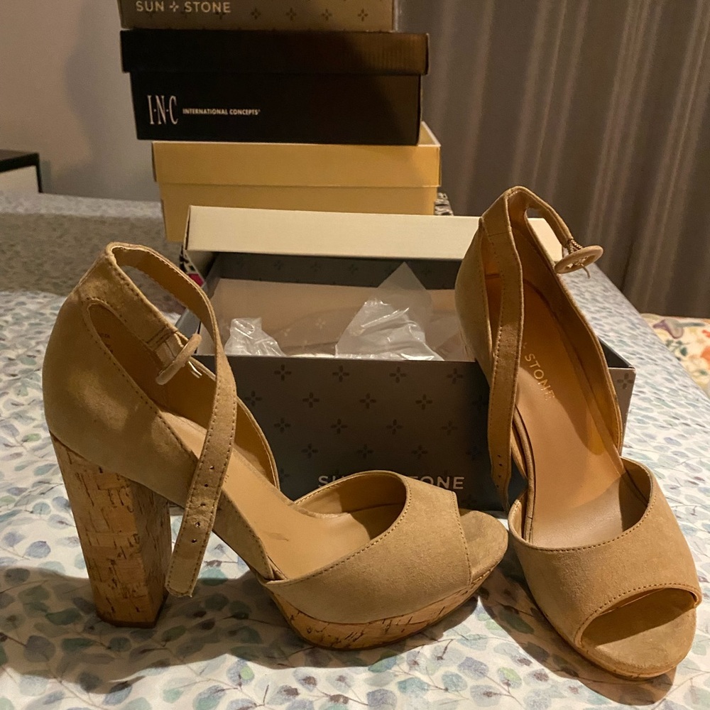 Used size 7 sun and stone platform tan color